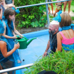 Neptuntaufe durch Kinder im Waldbad Neustadt